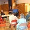 Tim King (standing) talks to local farmers and ranchers about adding canola as a cash crop to their current crop rotation. King plans on setting up a temporary, portable canola crusher in Oroville within the next two months and have a permanent crusher op