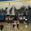 Tonasket senior Jessica Rhoads (right) slams the ball over the net against Omak while team mates senior Jayden Hawkins (middle) and junior Jessica Maier (left) prepare for the return hit during the Tigers’ home game against Omak on Saturday, Oct. 16. Ph
