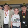 Henry “Hank” Allen from Oroville and his brother Loren, both veterans of World War II, with Justin Peterson at Spokane International Airport prior to the Allen’s flight to Washington, D.C. to see the World War II Memorial built in their and fellow W