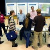 Members of the public speak with federal and state agency officials and check out materials relating to the EIS for Echo Bay Gold Exploration Company’s proposed gold exploration on Buckhorn Mountain. The company, part of Toronto-based Kinross Gold, want