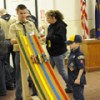 Dean Scott, a Tiger Dad and builder of the new Pinewood Derby Track lets the racers fly in the derby which took place at the American Legion Hall on Tuesday, Jan. 2. Photo by Gary DeVon