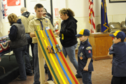 Dean Scott, a Tiger Dad and builder of the new Pinewood Derby Track lets the racers fly in the derby which took place at the American Legion Hall on Tuesday, Jan. 2. Photo by Gary DeVon