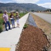 Oroville’s Mayor Chuck Spieth, owner of Spieth Insurance Agency located in the south of end of town and Barb Drummond, Streetscape Chairperson, making donations to Lidstrand’s project along Highway 97 were the flowers and shrubs are being planted. Spi