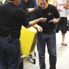 Ryan Skinner, Vice President of Carbon Cycle Crush tastes some of the canola meal produced at the demonstration held at the company's Oroville plant. The meal is highly desired by dairy farmers and poultry farmers for its high C3 Amino Acid content that i