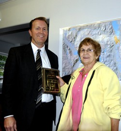 Oroville School Superintendent Steve Quick presents a plaque of appreciation to Jane Lynch for her 41 years of service to the Oroville School District. Lynch recently retired as a school bus driver. Photo by Gary DeVon