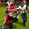 Oroville's Tony Kindred wraps up Brewster quarterback Easton Driessen during the Hornets' 24-7 loss to the Bears on Friday, Oct. 21. Photo by Brent Baker