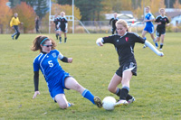 Bayle Tyus makes a tackle at midfield during Tonasket's 2-0 district tournament loss at Cascade.