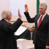 Washington State Supreme Court Justice Gerry Alexander swears in Chris Culp as the new Okanogan County Superior Court Judge in a ceremony held at the commissioners' hearing room last Friday, Dec. 2. Judge Culp, who was appointed to the position by Gov. Ch