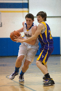 Zac Davis drives for two of his 10 points against Pateros on Saturday, Dec. 10.
