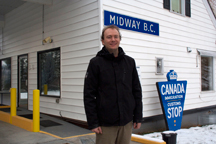 Midway Mayor Randy Kappes stands beside the border port that he says links Midway to future prosperity.