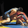 The Tigers' Kevin Aitcheson hung on against Brewster's Erik Gomez into the third period of his 152-lb. match with Brewter's Erik Gomez before being pinned.