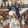 Photo by Brent Baker — John Stedtfeld tries to get to the hoop against Omak on Jan. 17, but picks up a charging call for hits efforts.
