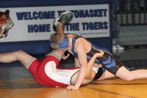 The Tigers' Caleb Lofthus gets his Chelan opponent on his back at Saturday's dual meet.