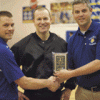 Photo by Brent Baker — Tonasket girls basketball coach Mike Larson (left) and athletic director Kevin Terris (right) accept the Okanogan Valley Officials Association Good Sportsmanship Award prior to Thursday's game with Omak. Presenting the award on be