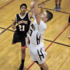 Photo by Brent Baker — Luke Kindred gets past Bridgeport's defense for two of his 10 points during Oroville's rout of the Mustangs last Tuesday.
