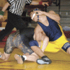 Photo by Brent Baker - Alex Alvarez and Selkirk's Michael Haskins continued their rivalry at Saturday's regional tournament. For the third time this season, Alvarez (shown wrestling Haskins at districts last week) edged Haskins by one point, this time cli