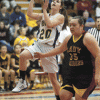 Photo by Brent Baker - The Hornets' Sierra Speiker cuts past Lake Roosevelt's Briana Monaghan on the way to the basket during Wednesday's season-ending loss to the Raiders.