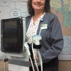 North Valley Hospital Director of Ancillary Services Noreen Olma shows of the hospital's new portable ultrasound unit at the NVH board of commissioners' meeting on Thursday, Feb. 23. photo by Brent Baker