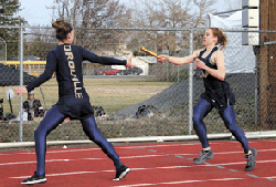 Submitted photo - Oroville's Callie Barker hands off to Kaitlyn Grunst at Ephrata on March 24.