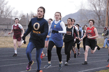 Photo by Brent Baker - Oroville's Sierra Speiker shook off an early challenge from Tonasket's Kylie Dellinger to win the 1600-meter run at the March 31 Eagle Home Mortgage Invitational.