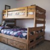 This win over full bunk bed, with storage drawers beneath, is just one of many models the Ensz family builds as part of their newly-opened 1-800-Bunkbed business. Photo by Brent Baker
