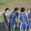 Brent Baker / staff photo - Damon Halvorsen (second from left), who later would qualify for state in the 3200, celebrates with the 4x100 relay team of Zach Villalva, Smith Condon, John Stedtfeld and Jake Hickman after their own state qualifying run.