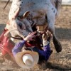Cheyne Olney gets up close and personal with his Round 2 partner on Saturday night. Olney ended up as the Founder's Day Rodeo top money-earner for the weekend. Brent Baker / staff photo