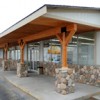 The owners of Frontier Foods have invested a lot in improving the exterior of their store, including new siding and paint, a reworked overhang out front, new river rock accents and a new sign (seen reflected in the window). A new roof is also being instal