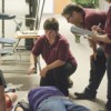 Tonasket EMS practices its response procedures on a pair of "victims" during Saturday's school shooting drill. Photo by Brent Baker