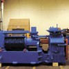 Leroy Smith, CCC Production Manager, stands next to a 1940/50's vintage French-brand seed crusher that was refurbished from two similar machines owned by the Carbon Cycle Crush. The machine, built in Piqua, Ohio, still needs to be hooked up to a 200HP ele