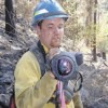 Tim Hoffman, an infrared field observer for the Washington Interagency Incident Management Team, shows the palm IR camera he used on the Buffalo Lake Road Fire. The camera is protected from dust and impact by a padded cover. The camera weighs about four