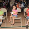 Christopher Castillo, age two, Keyli Castillo, age three and Kevin Castillo, age five, enjoy ice cream last Monday evening during the Open House at Oroville Elementary School. They were among the many students served ice cream and toppings in the gym by s