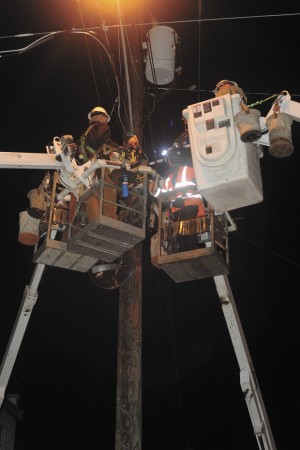How many  cable guys  does it take to... Contractors had four bucket trucks in the air as they worked furiously in cold, windy conditions last Monday evening while making upgrades to bring Charter Communication's HD television, high speed internet and phone service to Oroville (see article, page A7). The contractors, working for Sumner-based SEFNCO Communications are upgrading antiquated cable service in Oroville, some that's been around since the 1960s. When finished Charter promises the availability of 165 HD channels, as well as internet service up to 30 Mbps. Gary DeVon/staff photo