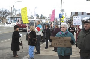 Several people protested the closing of the assisted living at North Valley Hospital. Brent Baker/staff photo