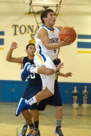 The Tigers' Michael Orozco glides in for a layup late in Saturday's win over Kettle Falls.