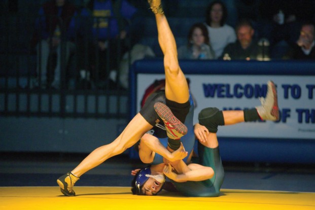 Tonasket's Collin Aitcheson (facing camera) displays some outrageous flexibility during his victory at 120 pounds on Saturday against Chelan. The Goats pulled out a 39-36 victory.