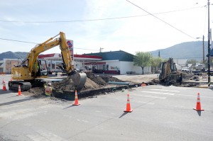 Work on replacing a water pipe from Main Street to Cherry via Central necessitated closing the north bound lane on Main Street/US 97 through town. Flaggers directed northbound and southbound while work was being done. Photo by Gary De Von