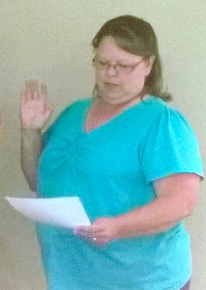 New Tonasket City Council member  Lous Rice takes her oath of  office on Tuesday, July 22.