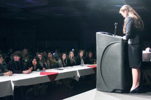 Vice President Tori Kindred Presides over Region Conference.  Oroville FBLA members support in front row.
