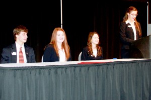 Members of the FBLA state executive team work with Tori Kindred at the FBLA Regional Conference in Wenatchee.  Left to right: Evan Taylor, Mikaela Branch, Keelin Hovrud and Tori Kindred