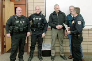 Deputies Shane Jones and Terry Schrable, Sheriff Frank Rogers, Oroville Police Chief Todd Hill and Mayor Chuck Spieth at the presentation of a check for $1000 toward the puchrase of a canine officer. Submitted photo