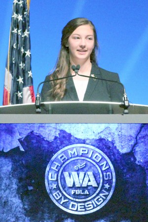 Newly Elected President Tori Kindred Speaks to the audience of two thousand members and advisers at the Washington State FBLA Business Leadership Conference held at the Performing Arts Center, INB in Spokane.
