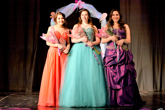 This year’s 2016 May Festival Royalty are l-r Princess Zoe Whittaker-Jameson, Queen Narya Naillon and Princess Lena Fuchs. The girls were chosen from a field of five would-be royalty at the  May Festival Selection Night held last Monday evening at the Oroville High School Commons. The selection was made both by  a panel of judges from Oroville, Tonasket and  Osoyoos as well as from voting by the audience. The girls were interviewed by the judges in private, as well as being judged on modeling and poise, an impromptu question and their speeches. 