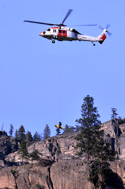 Ashlyn Godwin is lifted by a U.S. Navy Rescue helicopter after falling nearly 30 feet while hiking on Mt. Hull south of Oroville. Gary DeVon/staff photo