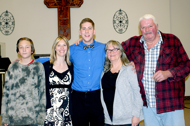 Tyler Brenon with his mom, brother and grandparents at his graduation ceremony held at the Valley Christian Fellowship. He graduated from a new drug treatment program at Timothy House near Ellisforde. Submitted photo