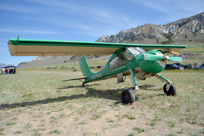 This plane was just one of several to attend the 2015 Tonasket Airport Improvement Club Fathers Day Fly-in. In the distance behind the plane, kids and their parents wait under the shade of a tarp for their chance to climb aboard. Pilots will offer free rides for kids ages eight to 15 on Sunday, June 19, from 8 a.m. to 11 a.m. Register for flights Sunday morning from 8 a.m. to 10 a.m. Katie Teachout/GT file photo