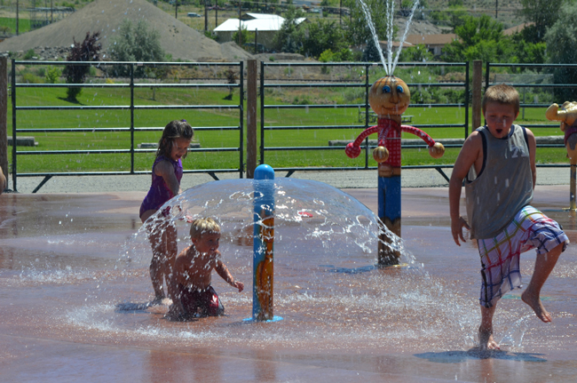 Lilly, Gunner and Caleb enjoy the Tonasket Water Ranch splash Park, which opened last week for kids to cool off from the summer heat. Katie Teachout/staff photo