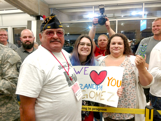 Annie Wilkison/submitted photo William Gomez is greeted on his return trip by his daughter and granddaughter, who drove over to surprise him at the Spokane Airport.
