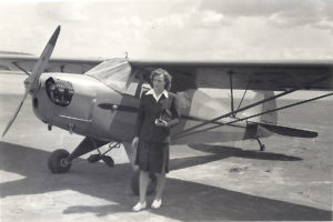 Dorothy with the  three-seat J-5 Piper Cub  she "won" by soloing before her dad, G.M. Scott, in spring 1941.