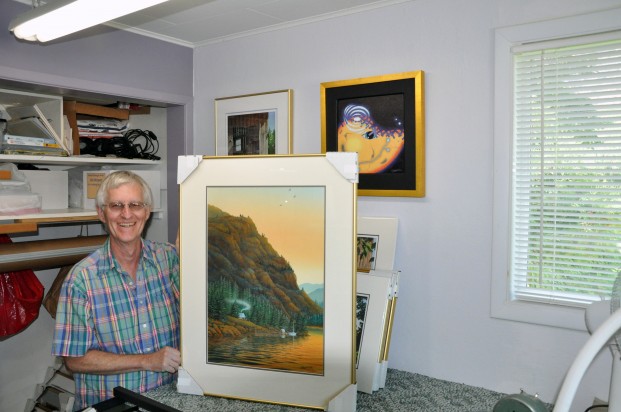 Jim Weaver in his Oroville studio, with "Lakeside Retreat"